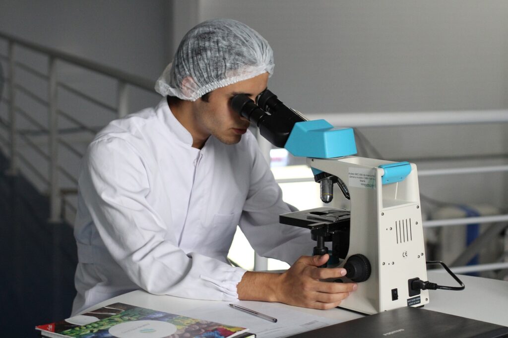 nutritional scientist with microscope